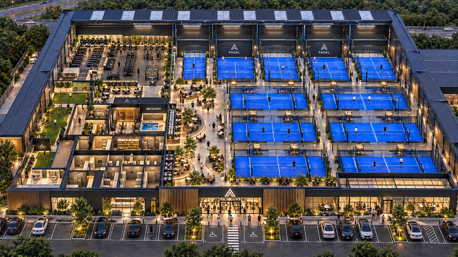 Cutaway aerial visualisation of the padel club at dusk: rows of blue indoor courts on one side, a gym, studios, recovery suite and golf simulator on the other, and a full car park in front